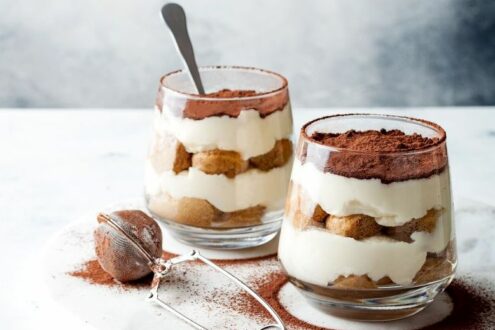 Traditional Italian dessert tiramisu in a glass. Traditional Italian dessert tiramisu in a glass.