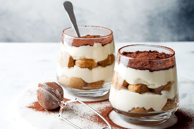 Traditional Italian dessert tiramisu in a glass. Traditional Italian dessert tiramisu in a glass.